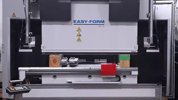 Large industrial machine in a factory setting.